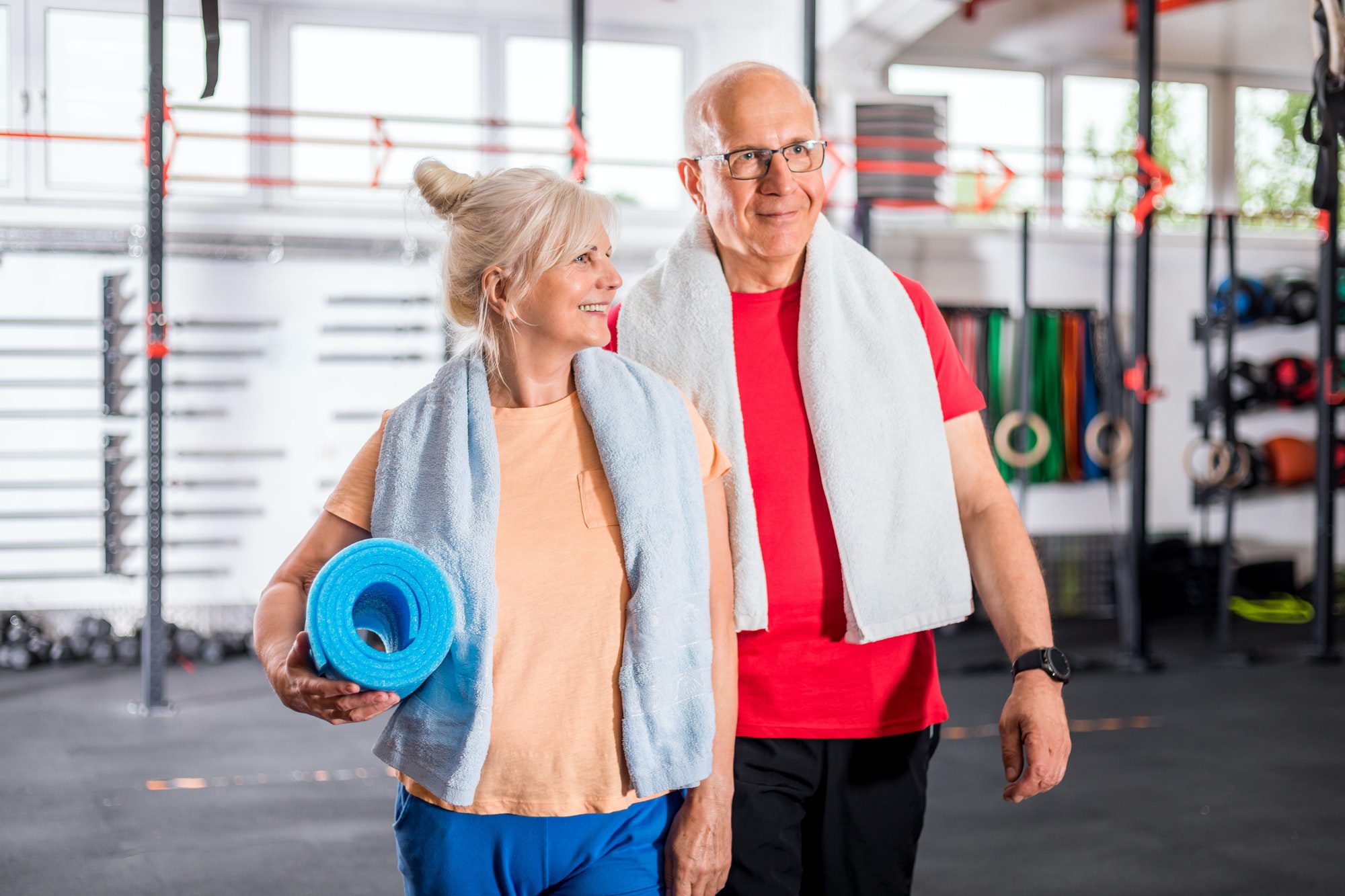 Missouri senior couple in the gym working out as they discuss their Missouri Medicare Plan.